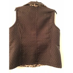 Christopher Bank’s reversible zippered vest.